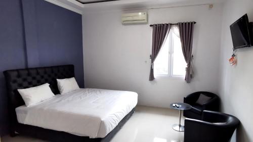 Кровать или кровати в номере Hotel Aqiilah Syariah