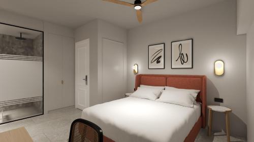 a bedroom with a large bed with white sheets at Albi Boutique Hotel - Traveler's Choice 2024 in Jerusalem