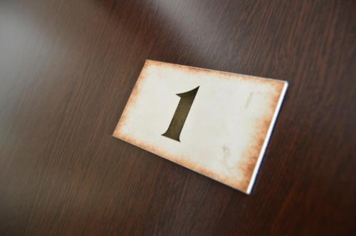 a block with the number one on it on a table at Penzion Batovka u Hoffera in Partizánske
