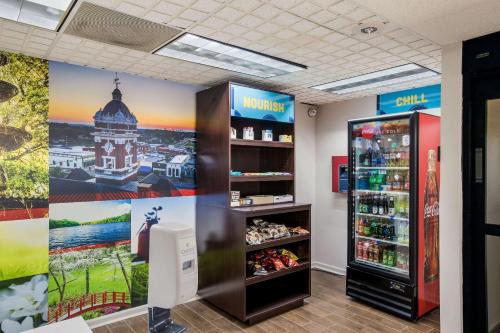 a store with two refrigerators and a drink refrigerator at Clarion Pointe Forsyth I-75 in Forsyth