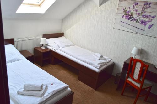 Postel nebo postele na pokoji v ubytování Penzion Batovka u Hoffera