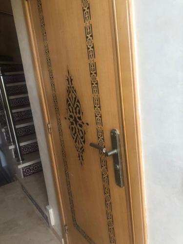 a wooden door with a design on it at Atlantic Beach View Villa in El Jadida