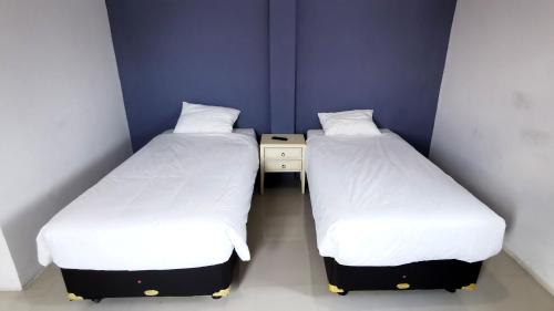 Кровать или кровати в номере Hotel Aqiilah Syariah