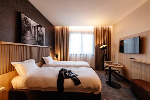 Postel nebo postele na pokoji v ubytování ibis Styles Arras Centre