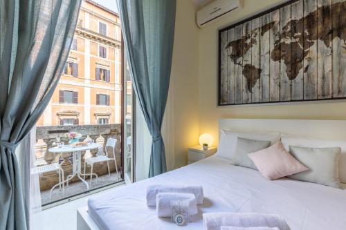 ローマにあるアルヴェアーレ ベッド＆ブレックファーストのベッドルーム1室(ベッド1台、大きな窓付)
