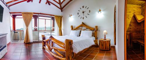 Postel nebo postele na pokoji v ubytování Hotel Campestre Cordillera de los Andes
