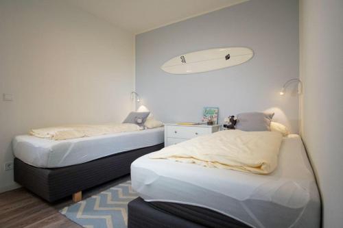 Postel nebo postele na pokoji v ubytování Duenenpark-Heiligenhafen-Haus-Duenengras-Wohnung-Duenentraum-Nr-2