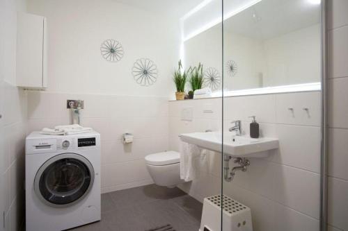 Koupelna v ubytování Duenenpark-Heiligenhafen-Haus-Duenengras-Wohnung-Duenentraum-Nr-2