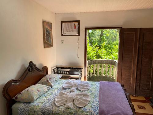 Ein Bett oder Betten in einem Zimmer der Unterkunft Rio Natureza apart 112