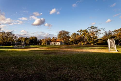 a soccer field with a goal in the grass at Nes Ammim Hotel in Nes Ammim