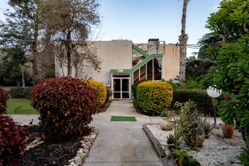 a building with a walkway in front of it at Nes Ammim Hotel in Nes Ammim