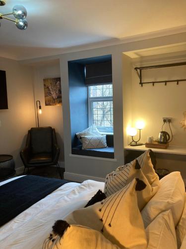 a bedroom with a dog laying on a bed at Abbey Court Guest House in Carlisle
