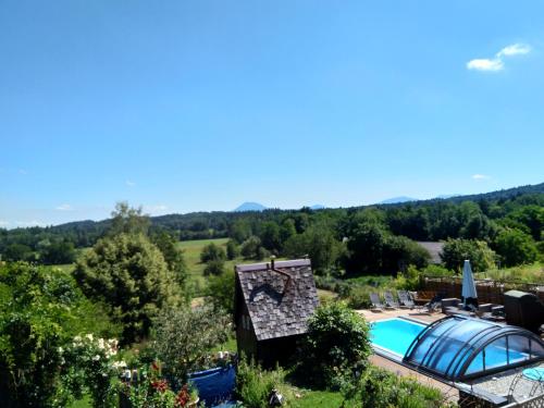 an aerial view of a villa with a swimming pool at Schlossberghof Marzoll in Bad Reichenhall