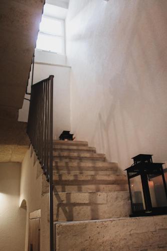 a set of stairs in a building with a stair case at Il Campanile Premium B&b in Altamura