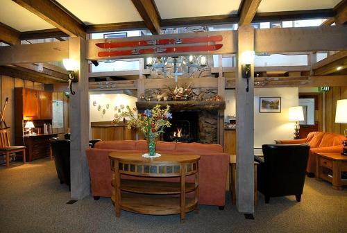 a living room with a couch and a fireplace at Cristiana Guesthaus in Crested Butte