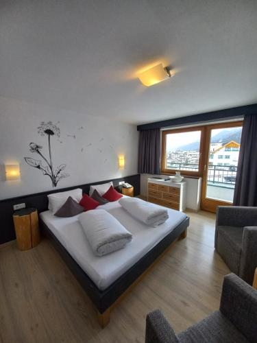 Ένα ή περισσότερα κρεβάτια σε δωμάτιο στο Hotel Casada - inklusive Sommer Card