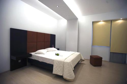 A bed or beds in a room at INOH HOTEL