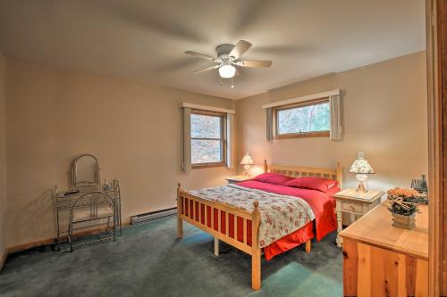 a bedroom with a bed and a ceiling fan at Elka Park Townhome with Views about 5 Mi to Skiing! in Elka Park