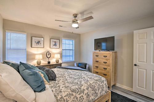 a bedroom with a bed and a tv and a dresser at Welcome to After Dune Delight Golf Course Condo! in Pawleys Island