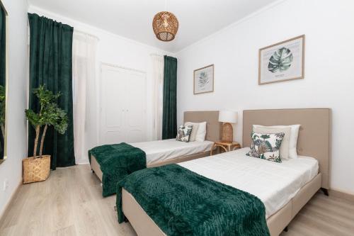 Postel nebo postele na pokoji v ubytování Akisol Albufeira Light