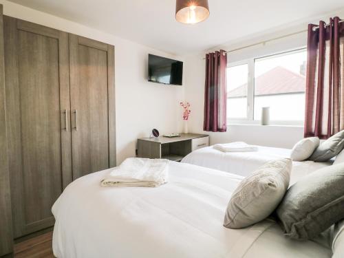 מיטה או מיטות בחדר ב-Hollinwell View