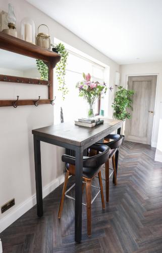 a dining room with a table and chairs at Luxury 2 bed 5 mins from Carrick next to Waterfall in Carrick on Shannon