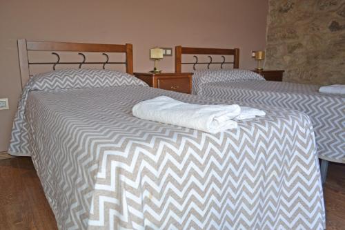 Postel nebo postele na pokoji v ubytování Hotel Rural Val Dos Pigarros