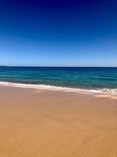 a sandy beach with the ocean in the background at Playa Esquinzo 1 Jandia Fuerteventura in Playa Jandia