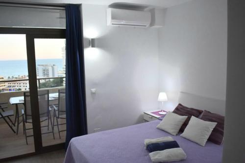 Кровать или кровати в номере Apartamento Playamar