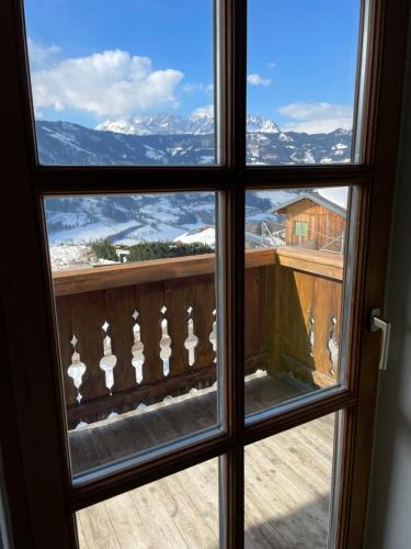 a window view of a mountain view from a house at Apartment Sabrina in Sankt Johann im Pongau