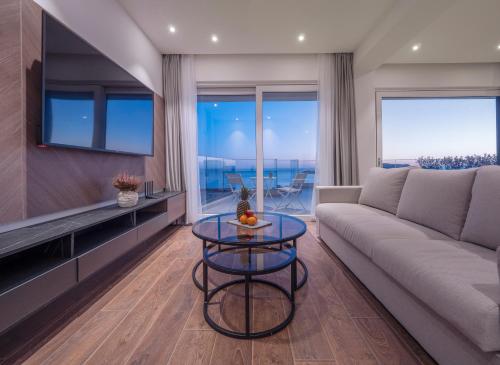a living room with a couch and a table at Horizon Two bedroom Penthouse with Hot tub in Becici