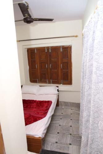 a small room with a bed and a window at Hotel Yash Paradise 6 Min Distance from Dargah in Ajmer