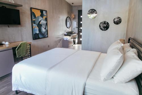 A bed or beds in a room at Mother Earth Luxury Boutique Hotel, Restaurant & Spa