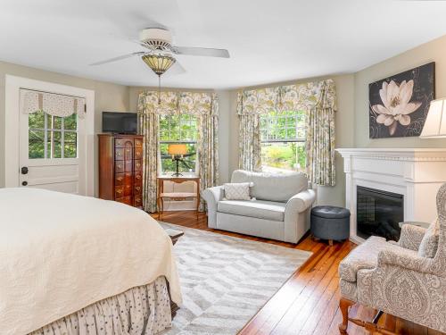 a bedroom with a bed and a fireplace at Pinecrest Bed & Breakfast in Asheville