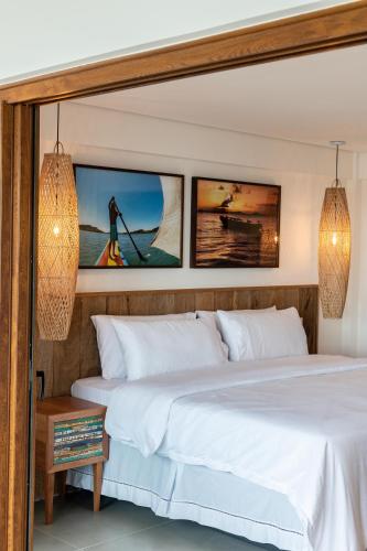 Postel nebo postele na pokoji v ubytování One Beach Boutique Hotel