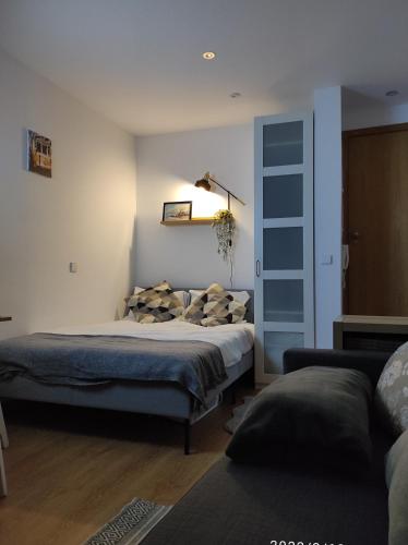 a bedroom with a bed with pillows on it at Porto Downtown Taipas in Porto