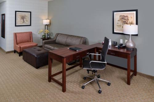 an office with a desk and a chair and a desk and a chair at Comfort Suites Airport Tukwila Seattle in Tukwila