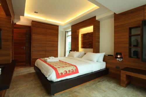 Tempat tidur dalam kamar di Baannueng at Aree 5 Hotel