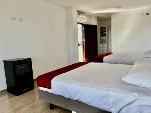 Un pat sau paturi într-o cameră la Sumaq House offer a new suite