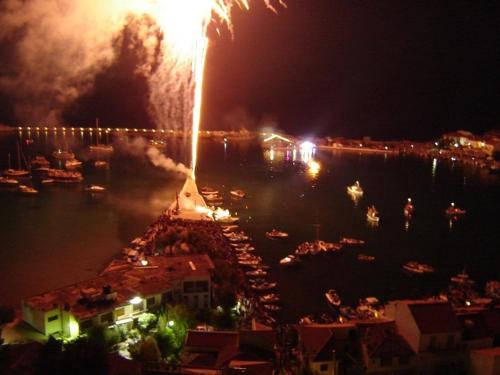 a group of boats in the water with fireworks at Hera 2 in Pythagoreio