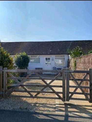 a wooden fence in front of a house at The Salty Bee in South Hayling