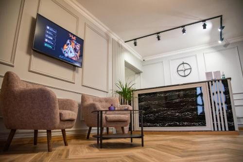 TV a/nebo společenská místnost v ubytování T&S Apart-Hotel