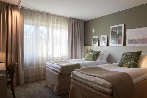 Postel nebo postele na pokoji v ubytování Best Western Hotel Danderyd
