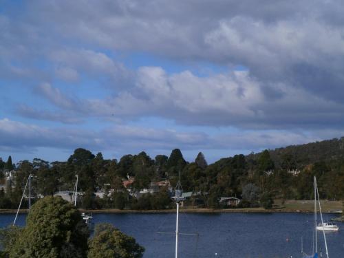 a view of a lake with boats in the water at Waterfront Lodge Motel in Hobart