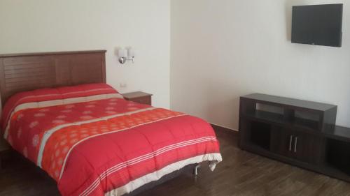 Letto o letti in una camera di Hotel Tito