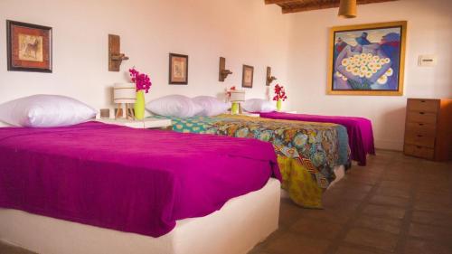 En eller flere senge i et værelse på Casa de Campo La Escondida