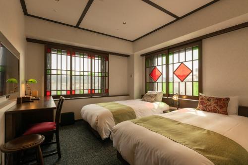 Tempat tidur dalam kamar di Hotel Aru Kyoto Sanjo Kiyamachi Do-ri
