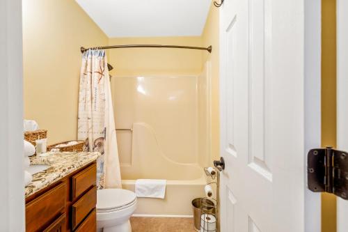 a bathroom with a toilet and a shower at Myrtle Beach Getaway in Myrtle Beach