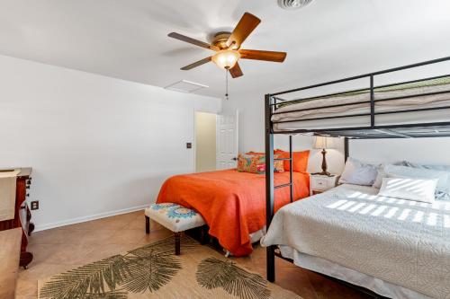 a bedroom with a bed and a ceiling fan at Myrtle Beach Getaway in Myrtle Beach