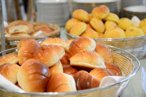a bunch of buns in baskets on a table at Sapporo Park Hotel in Sapporo